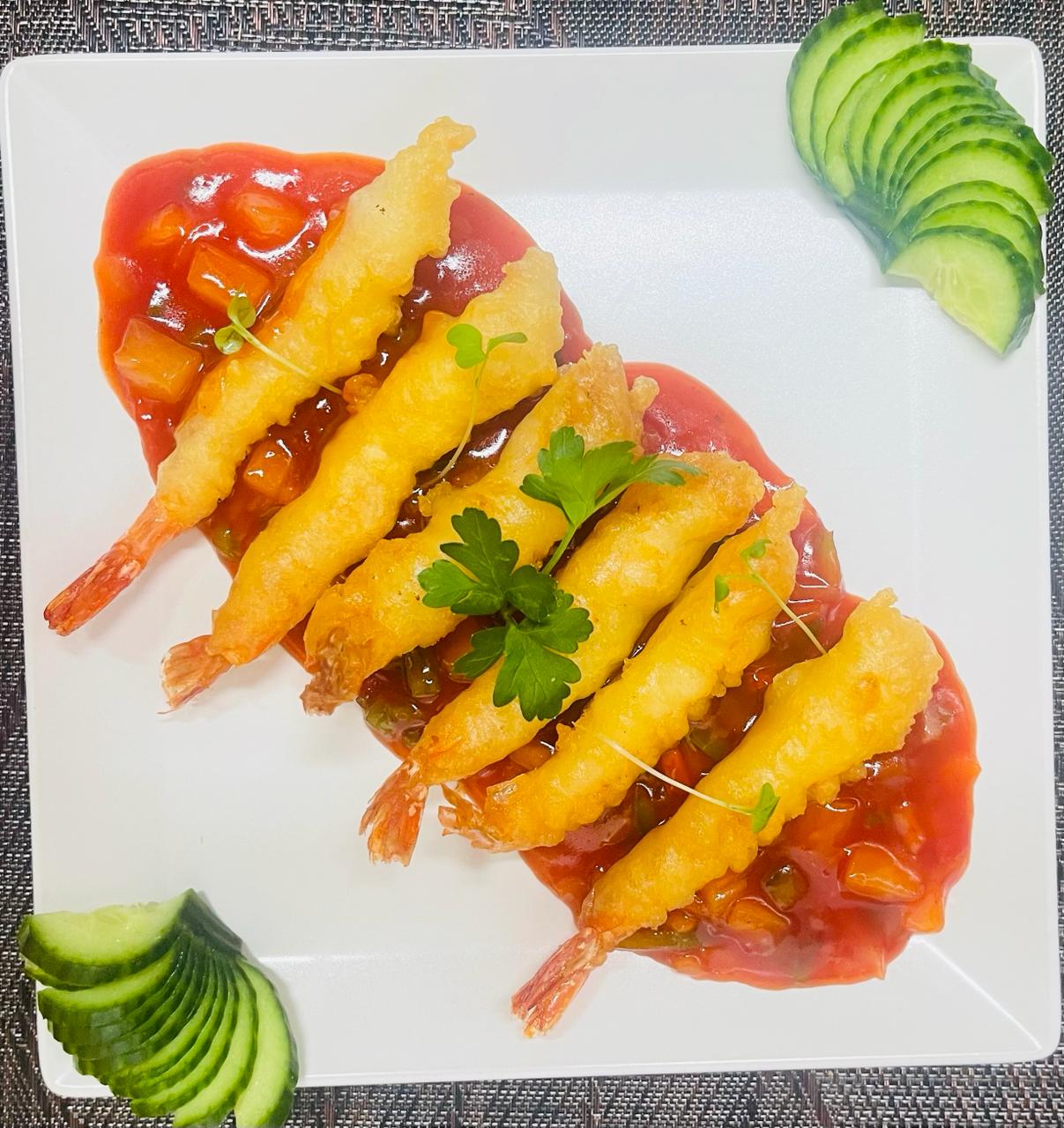 Crispy prawns with sweet and sour sauce and cucumber